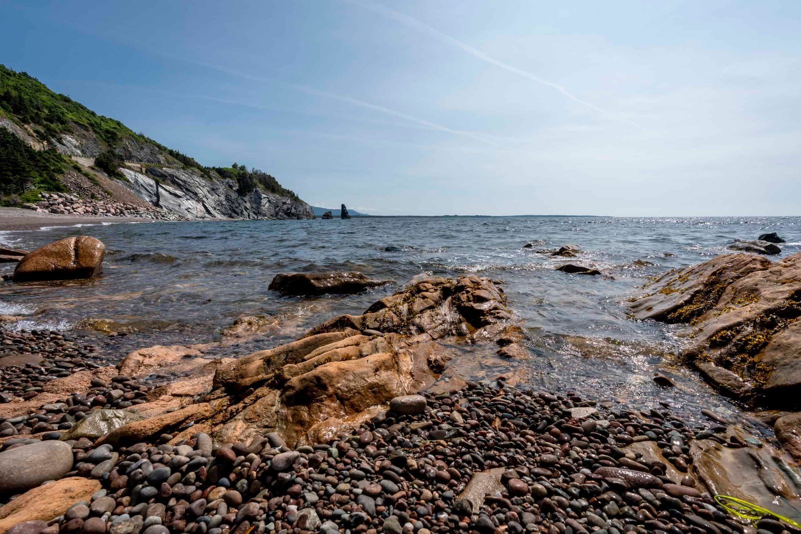 Rocks and water on the shore of a beach. Weekend Getaway on Cape Breton Island